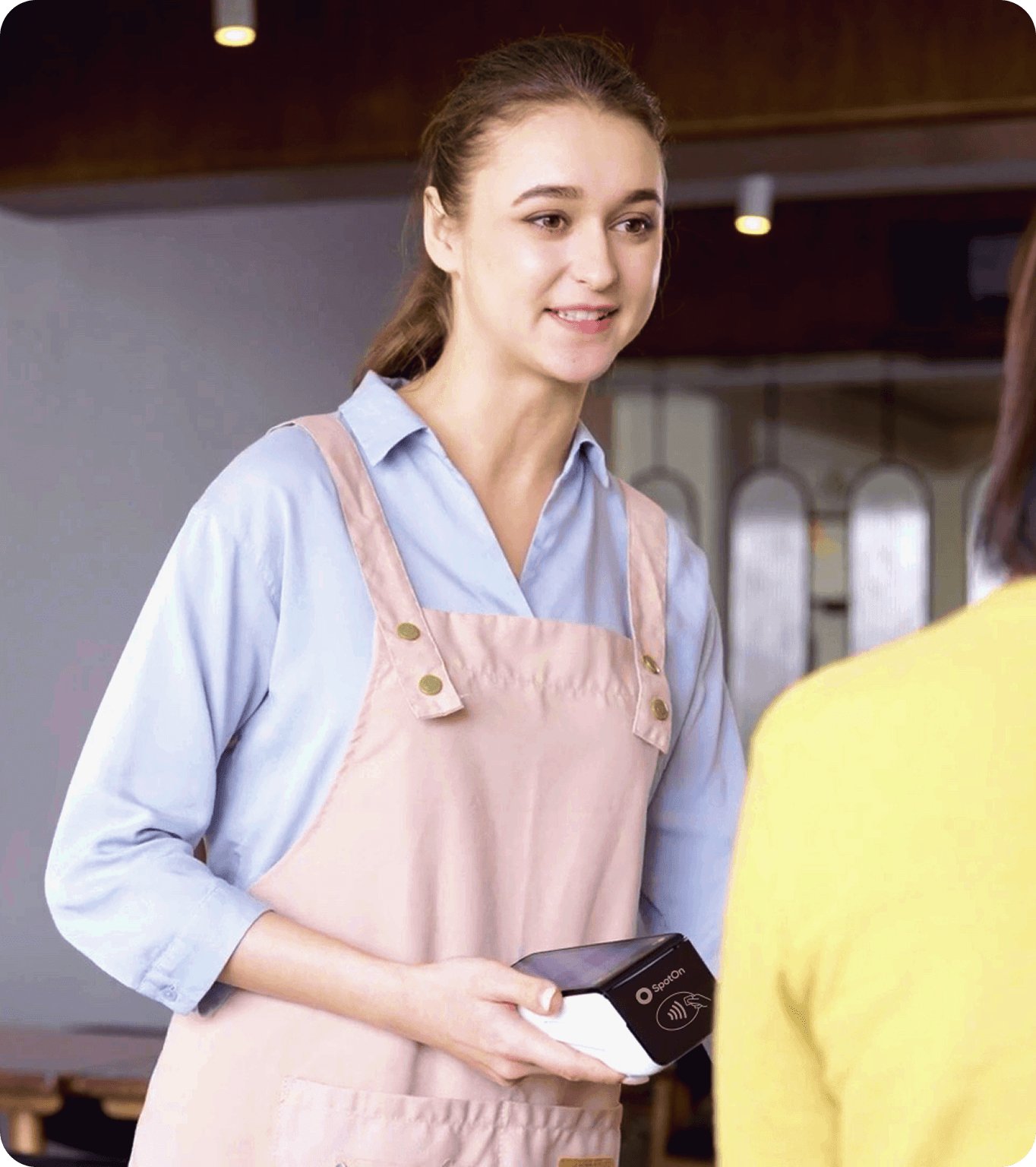 A small business employees runs a transaction with a surcharge