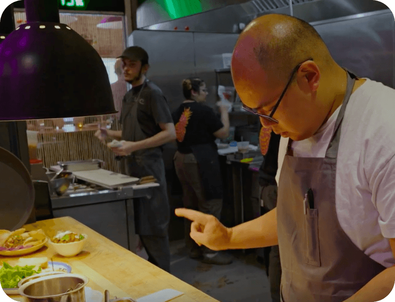 Parnass Savang, Head Chef at Talat Market, preparing food in the kitchen
