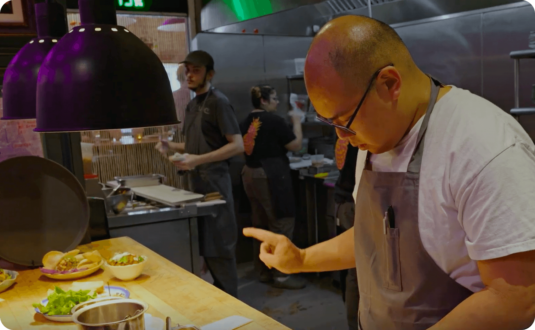 Parnass Savang, Head Chef at Talat Market, preparing food in the kitchen