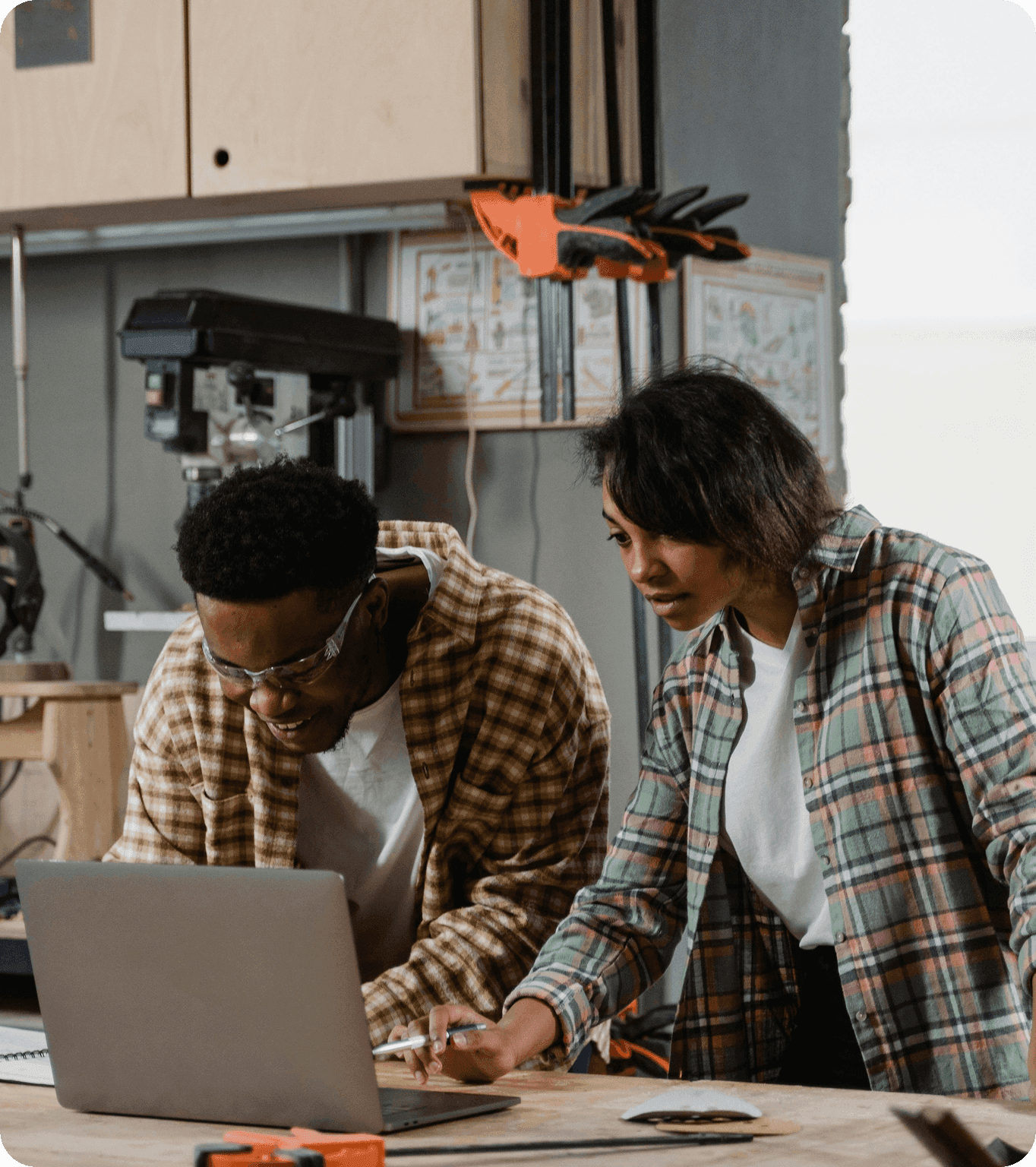 A small business owner runs a payment  from their computer in the back office