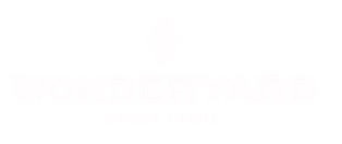 Wonderyard Garden + Table logo with stylized lettering and decorative emblem