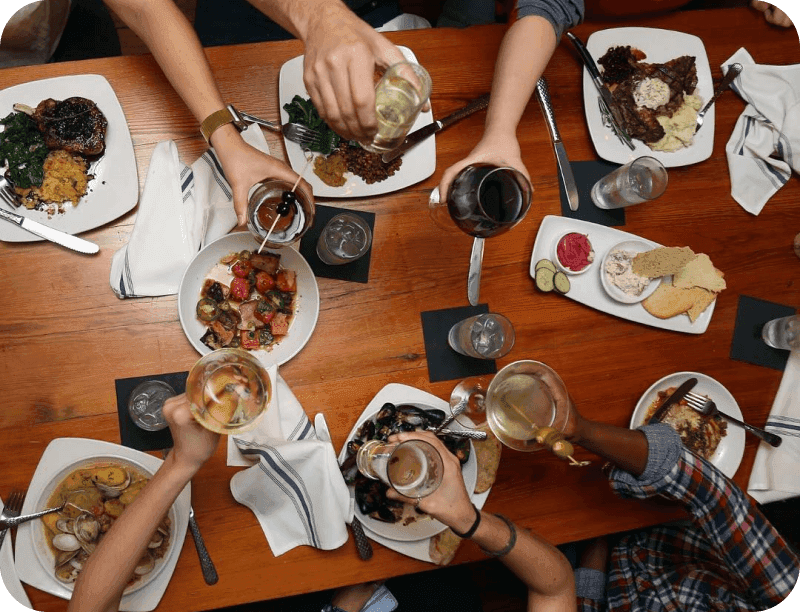 Guests enjoying food and drinks at 11th and Bay Southern Table