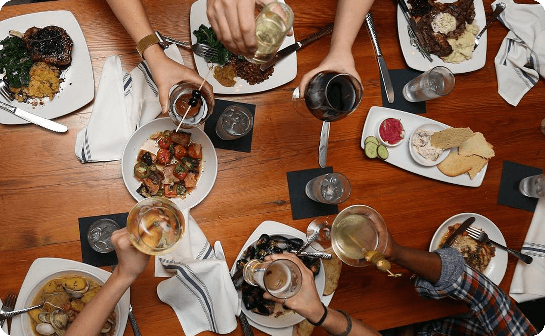 Guests enjoying food and drinks at 11th and Bay Southern Table