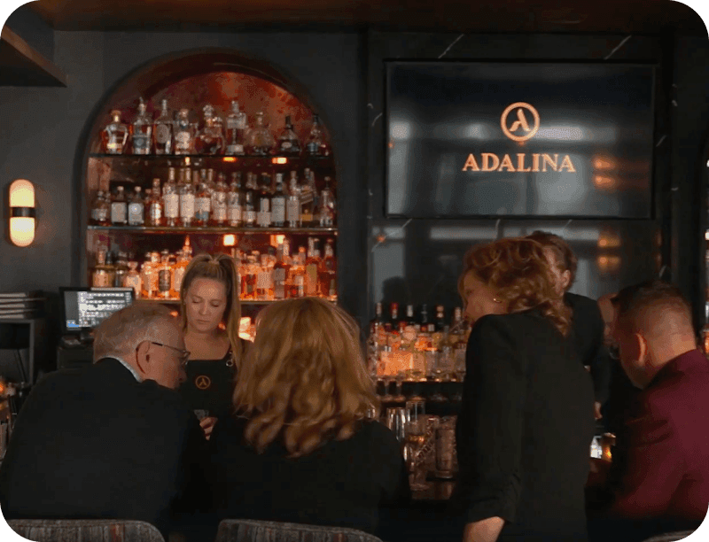 Guests at the bar at Adalina restaurant