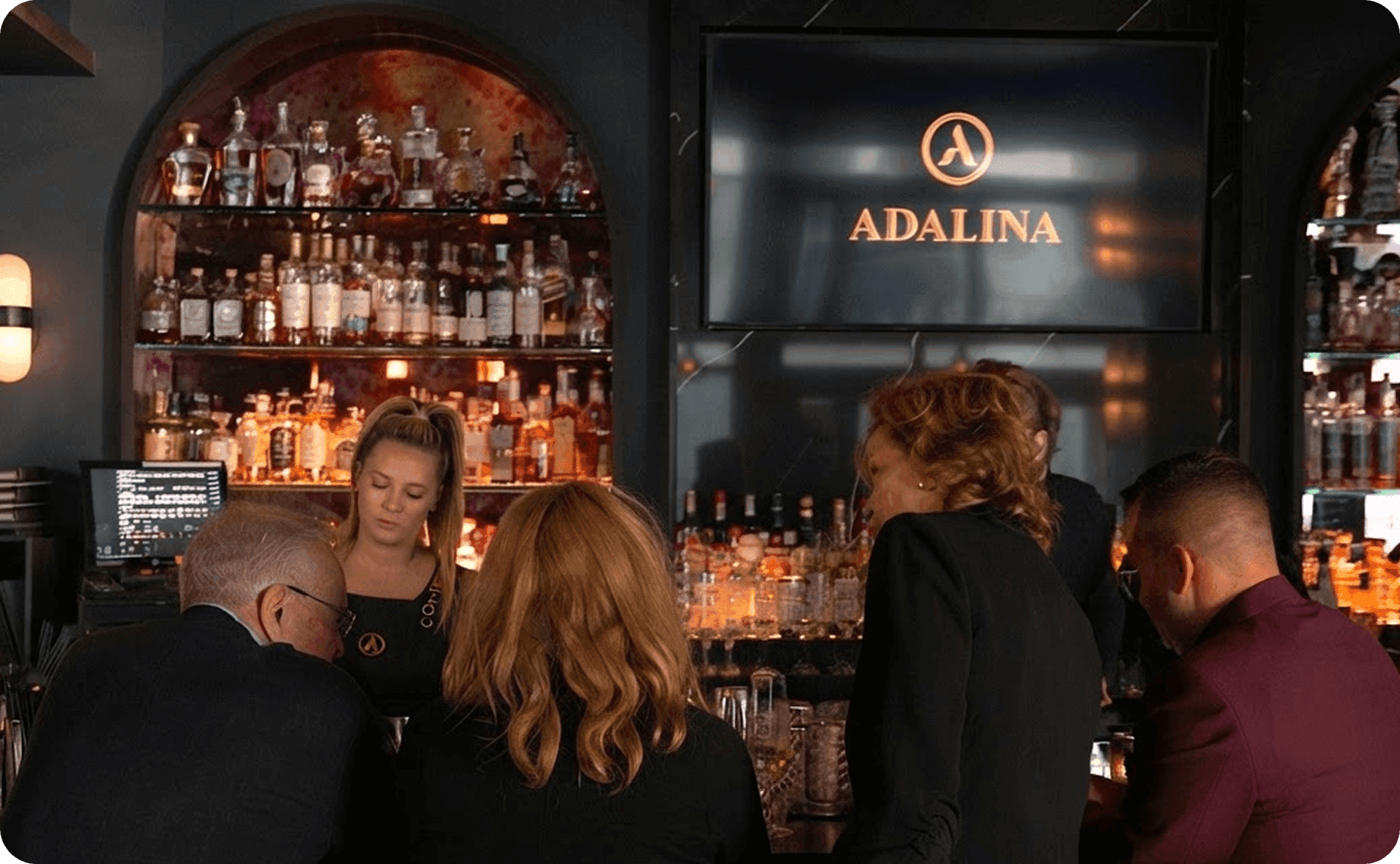 Guests at the bar at Adalina restaurant
