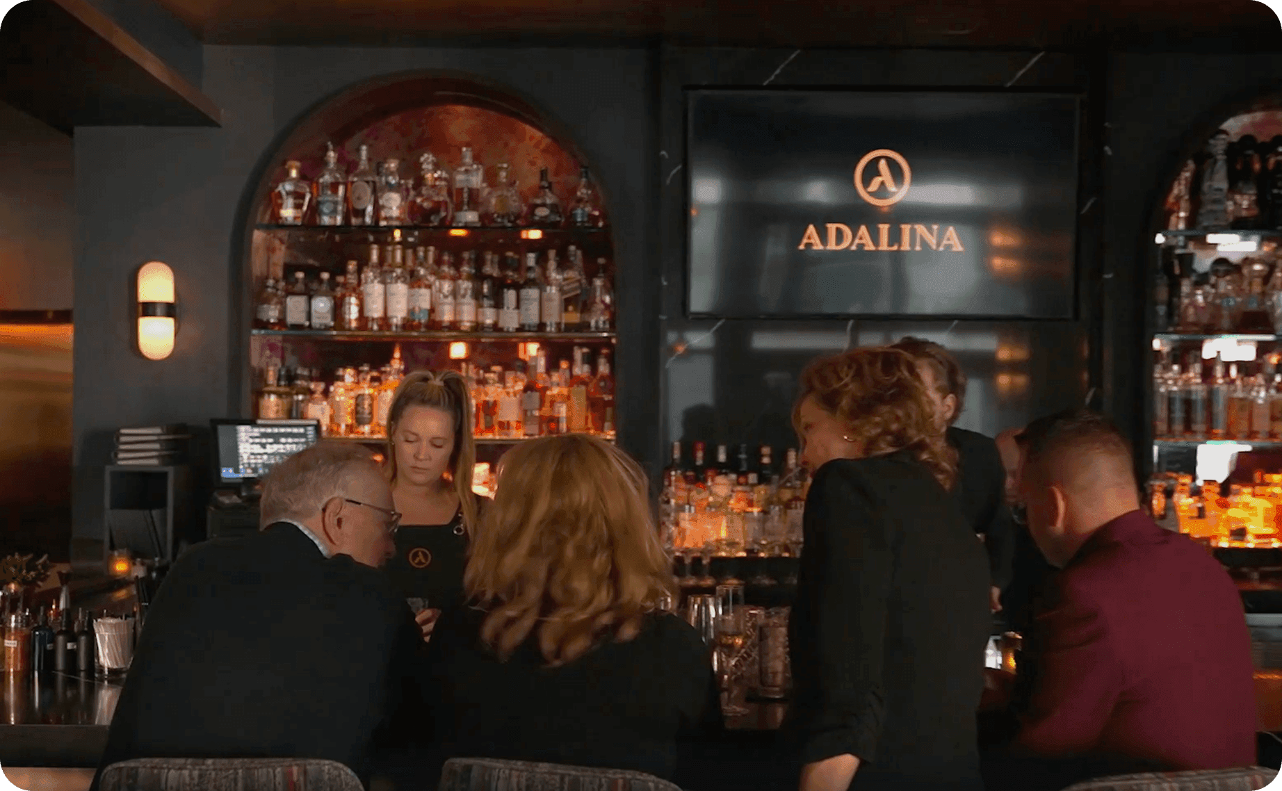 Guests at the bar at Adalina restaurant