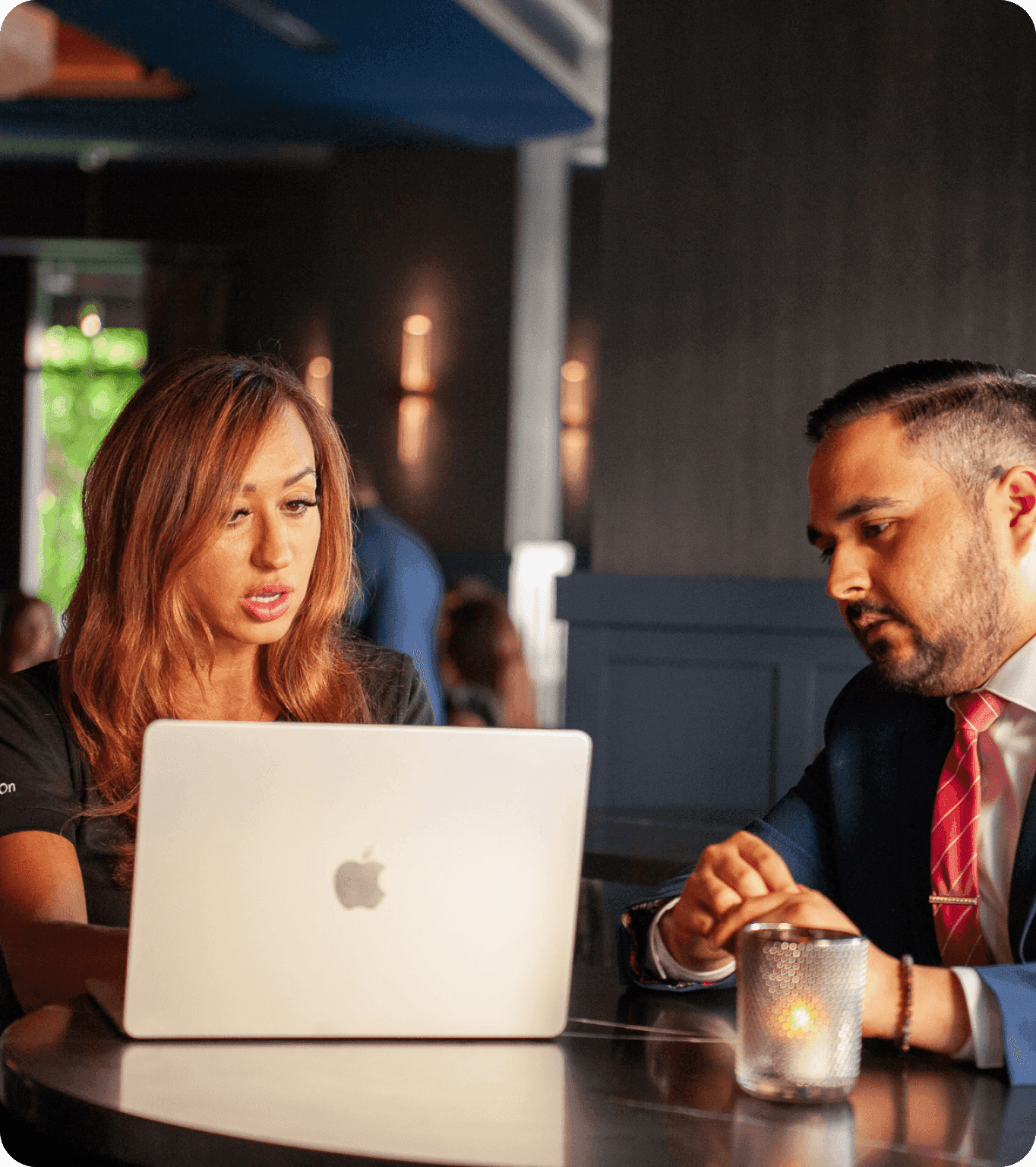 Two dealers networking and discussing business over coffee