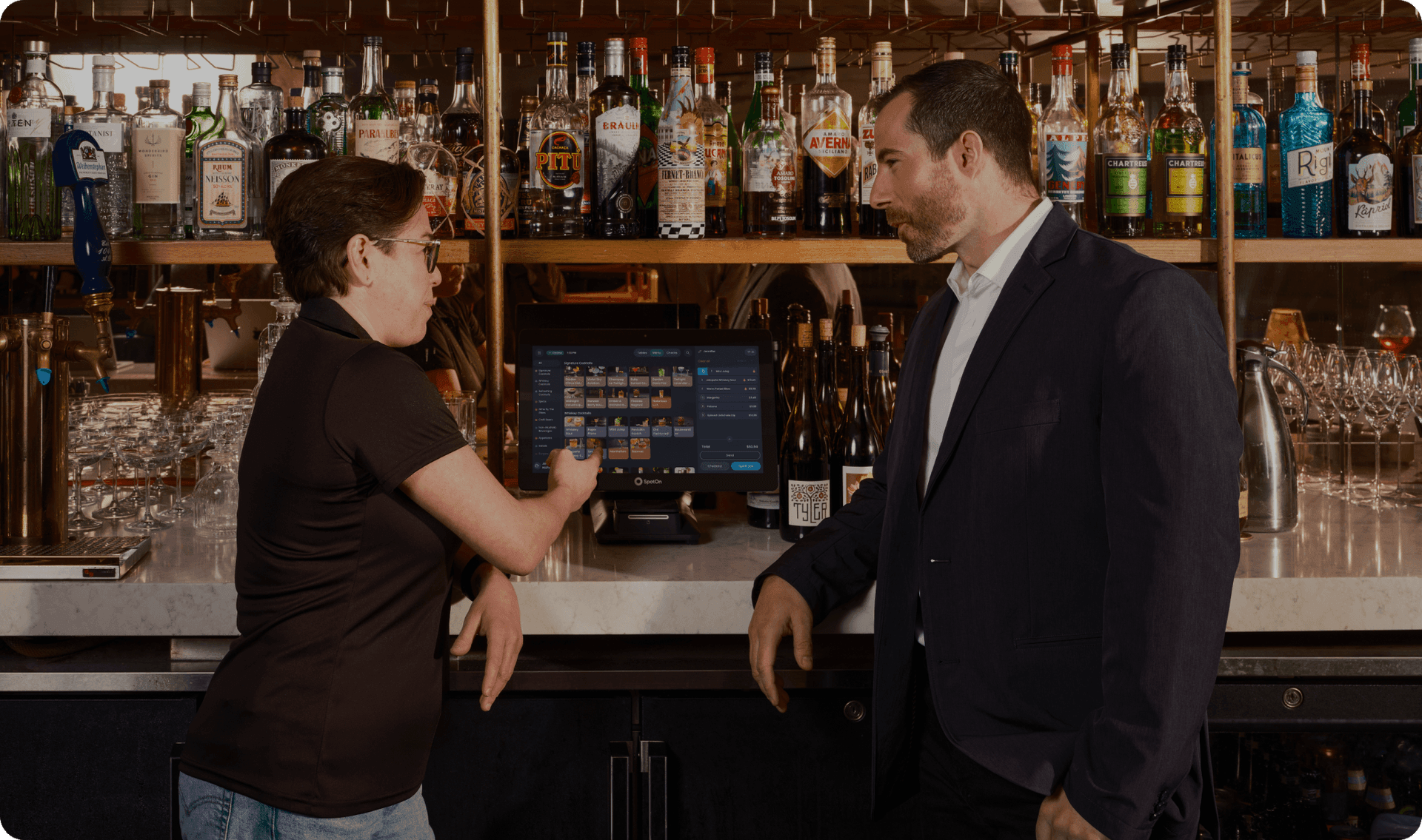 SpotOn rep assisting a restaurant operator with their POS system