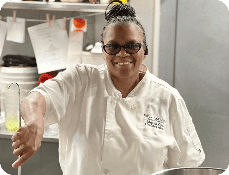 A chef stirs a pot of shrimp in the kitchen at Pat’s of Henderson