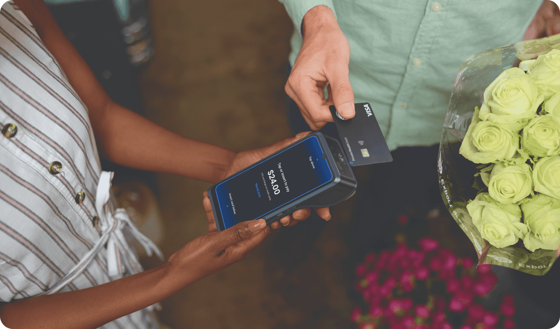 A small business employee runs a payment on a POS terminal