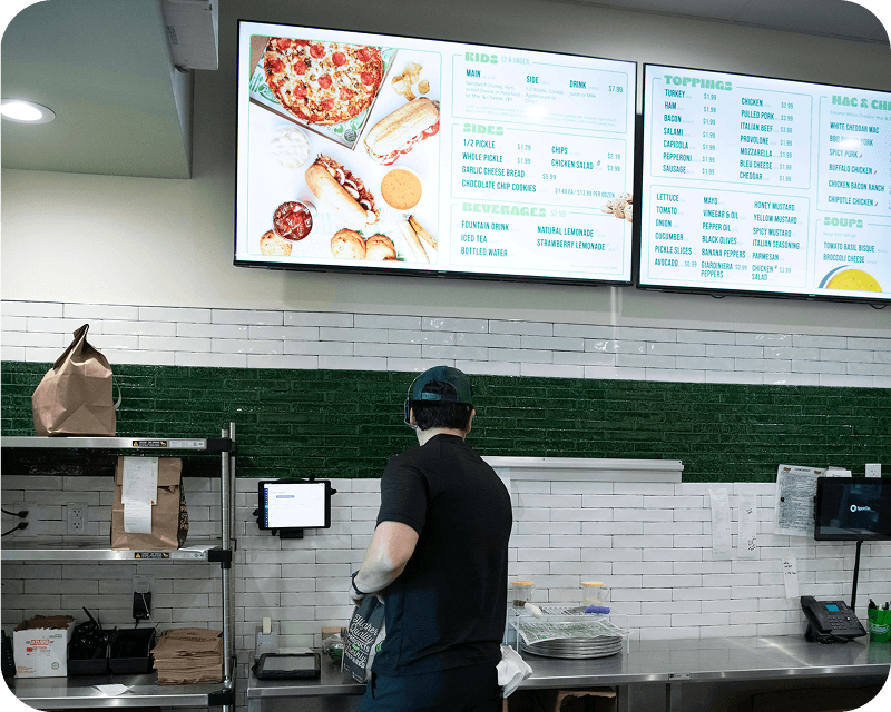 A restaurant's digital menu board displaying its food and drink offerings