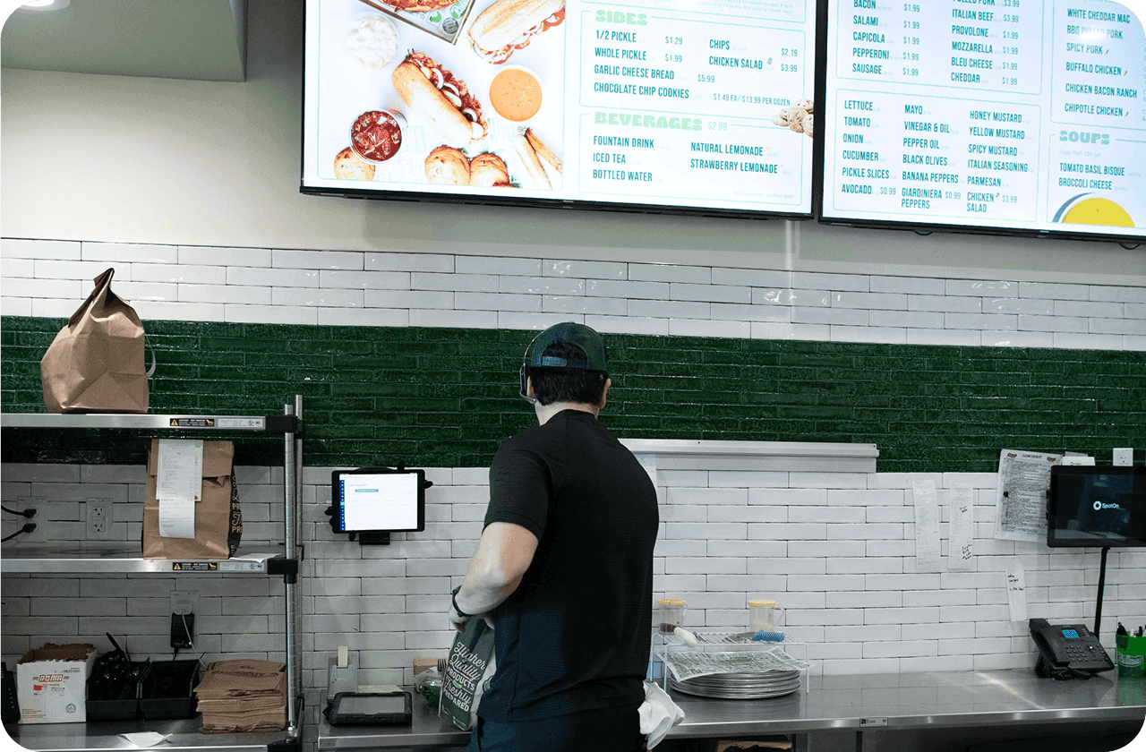 A restaurant's digital menu board displaying its food and drink offerings
