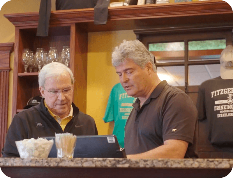 A SpotOn dealer talking to a restaurant owner