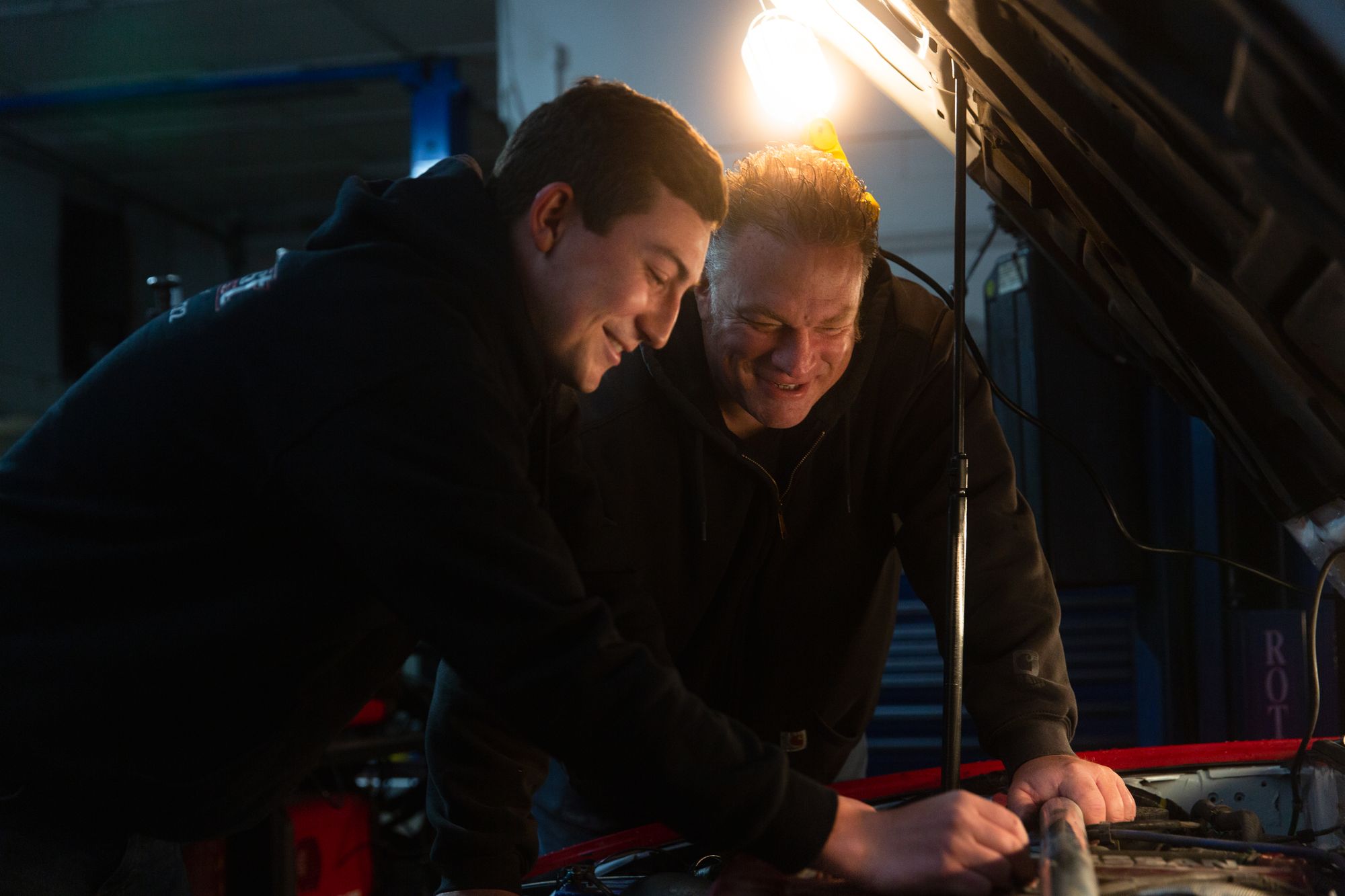 Derek Griffith and his father John repair a JDM vehicle at Northeast Auto Parts.