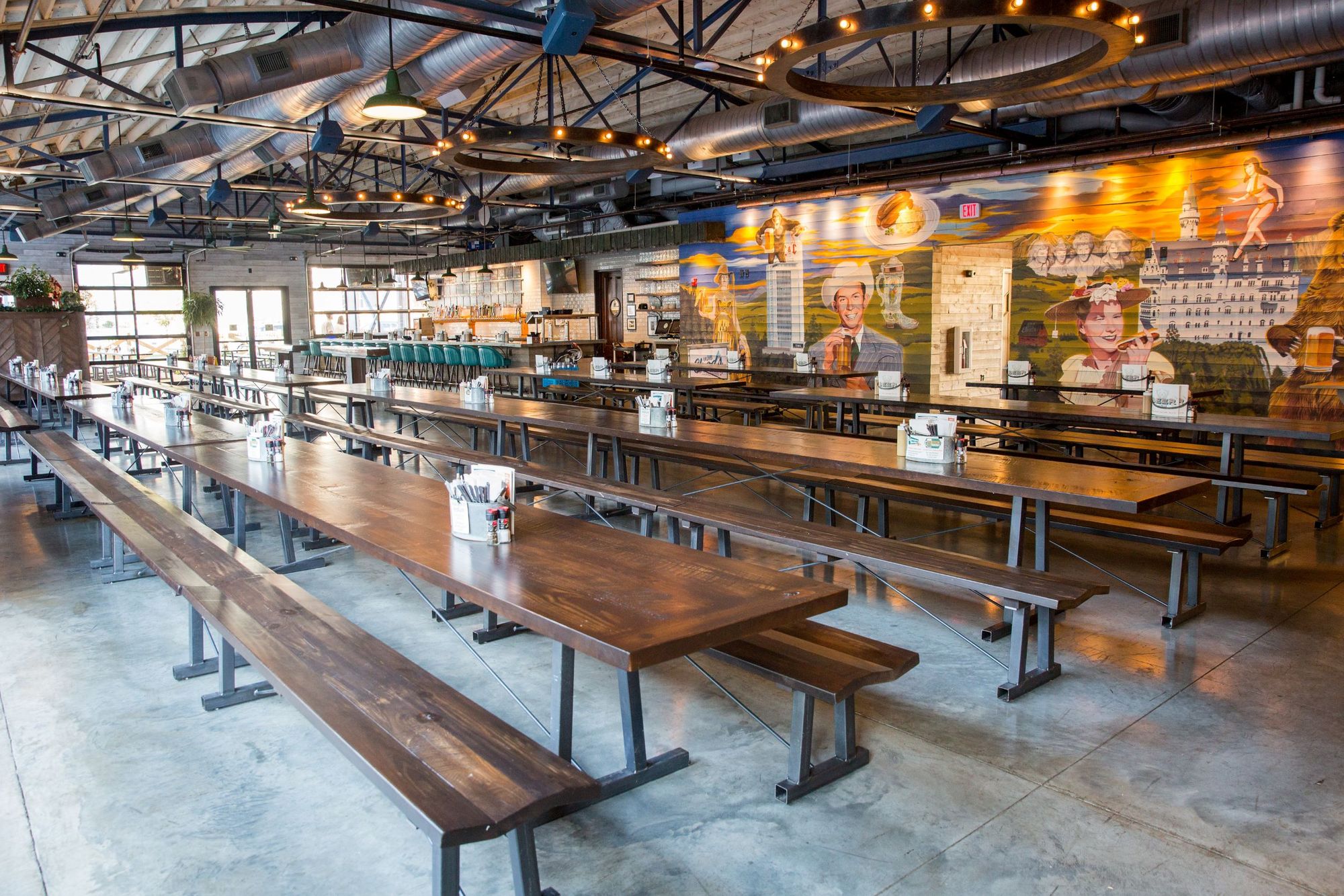 The inside of Von Elrod's Beer Hall and Kithcen in Nashville, Tennessee restaurant with long bench tables.