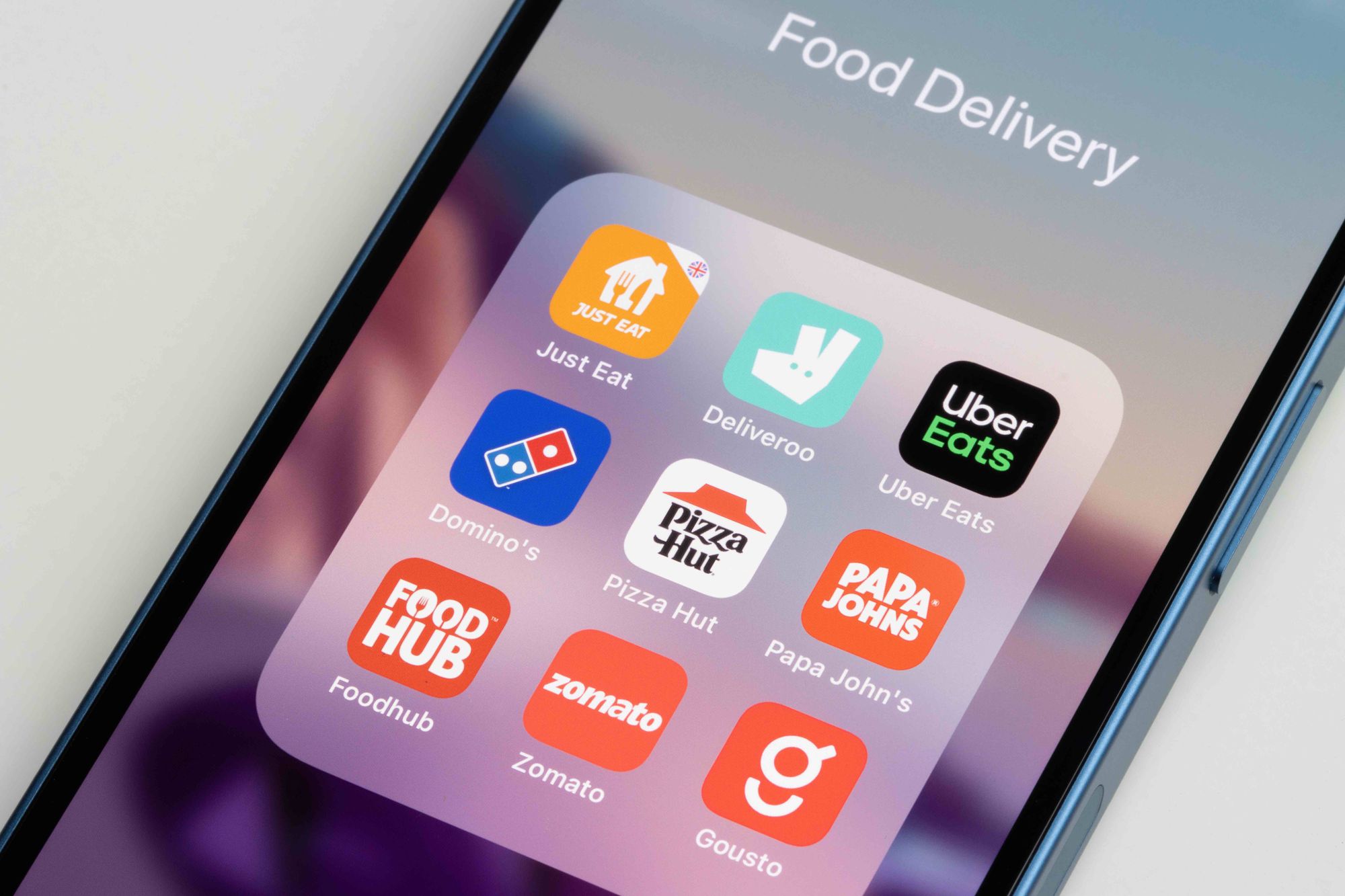 A phone displaying a group of third-party delivery apps.