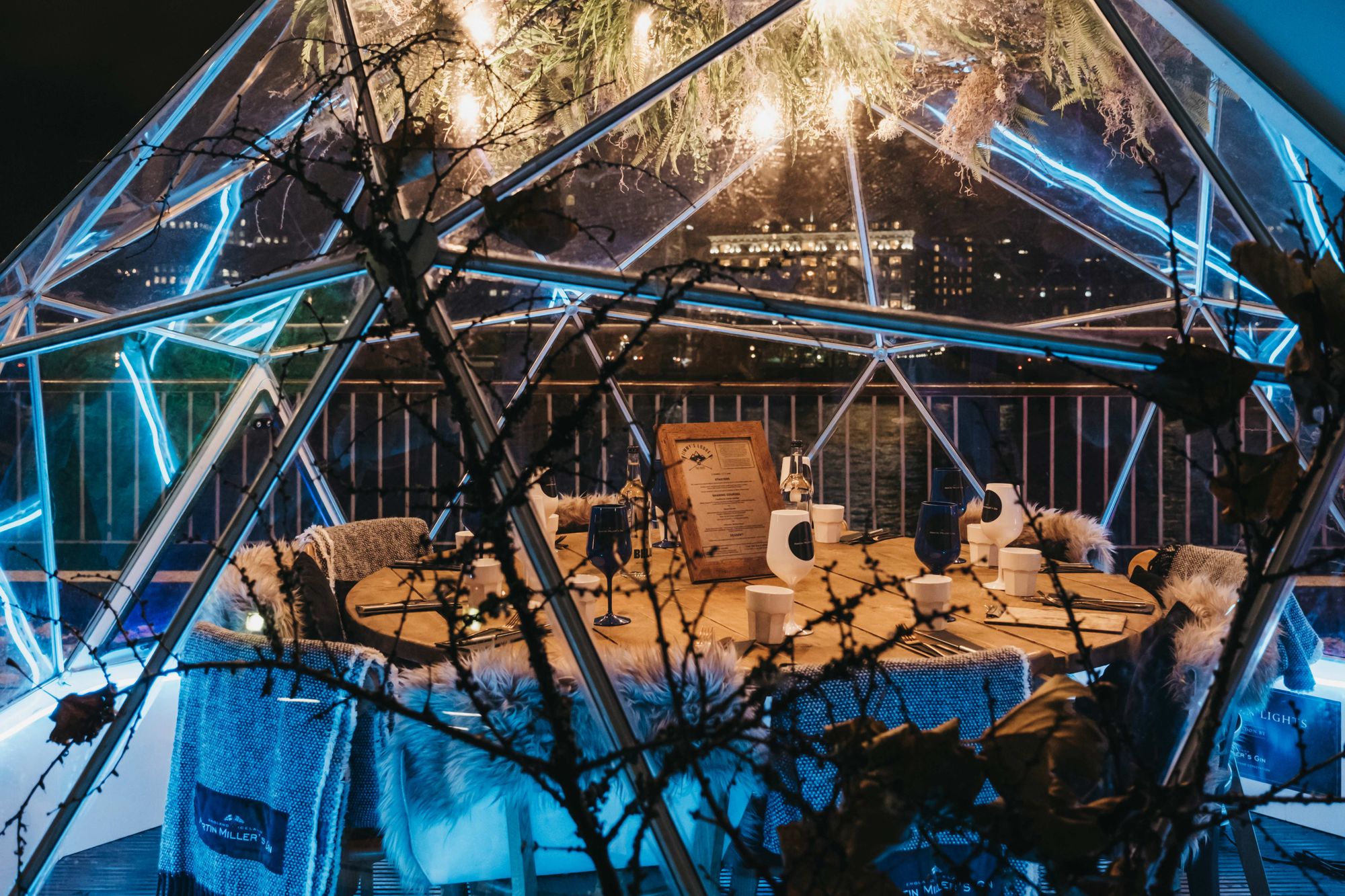 Jimmys Lodge Snow Globe, a unique pop-up restaurant dining area in London, placed inside a glass globe