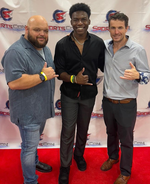 Chris King (left) and Patton Nix (right) at SportsCon with a third person posing in between them.
