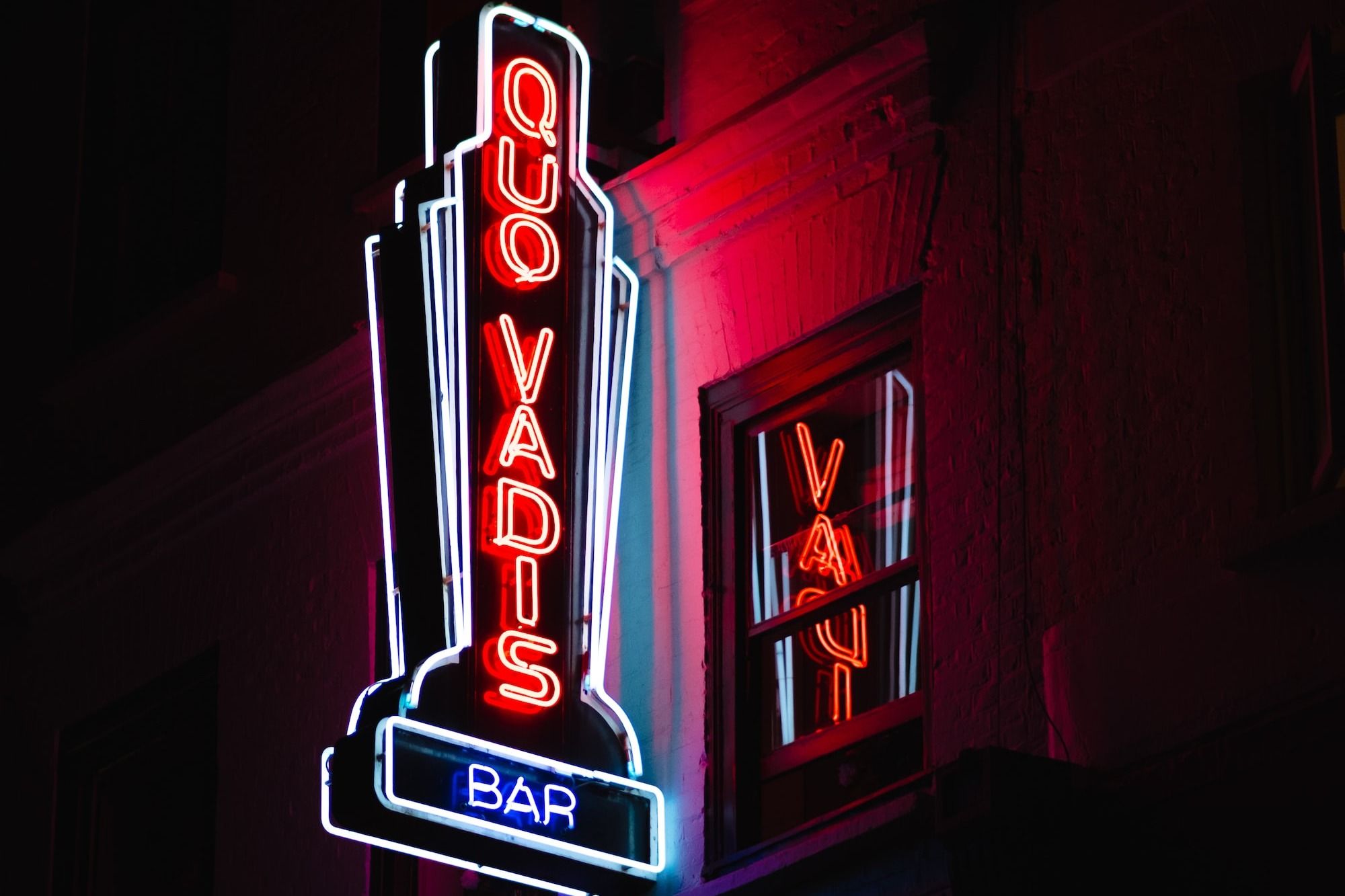 Quo Vadis bar lighted signage
