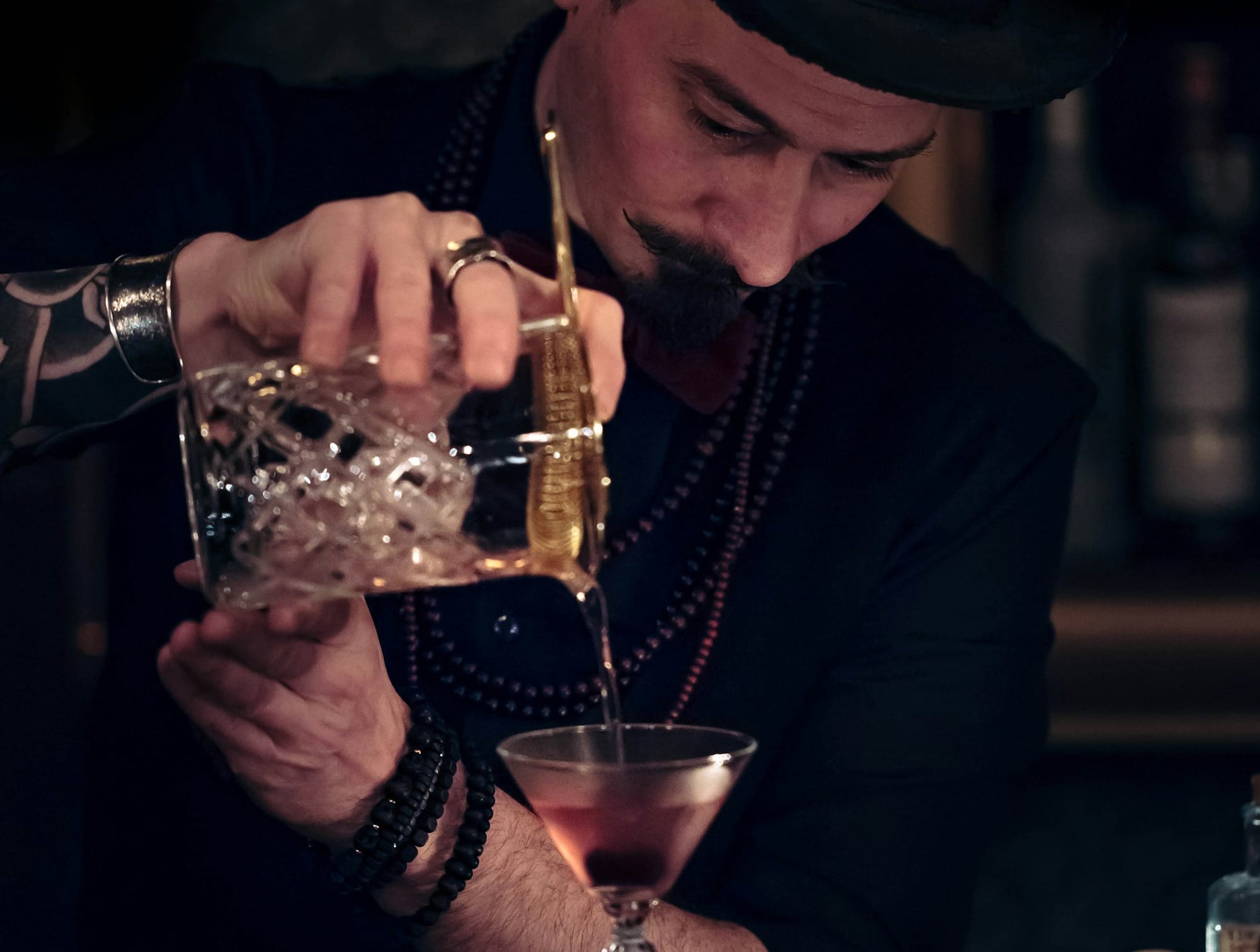 Man pouring a mocktail for Christmas time at the bar.