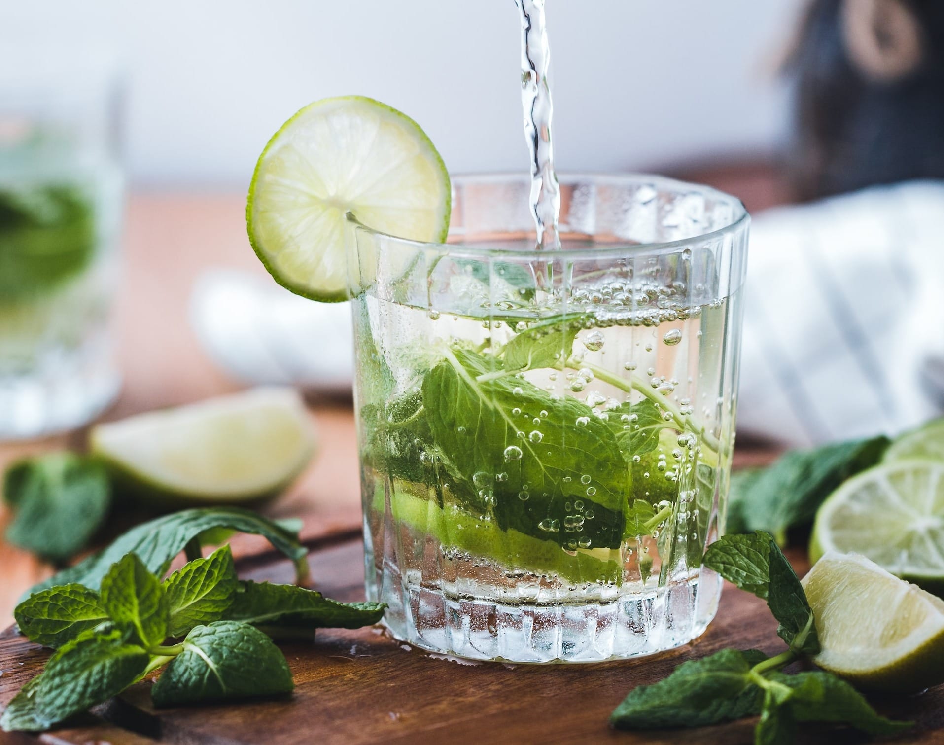 Clear cup with mocktail Mojito and lemon lime.