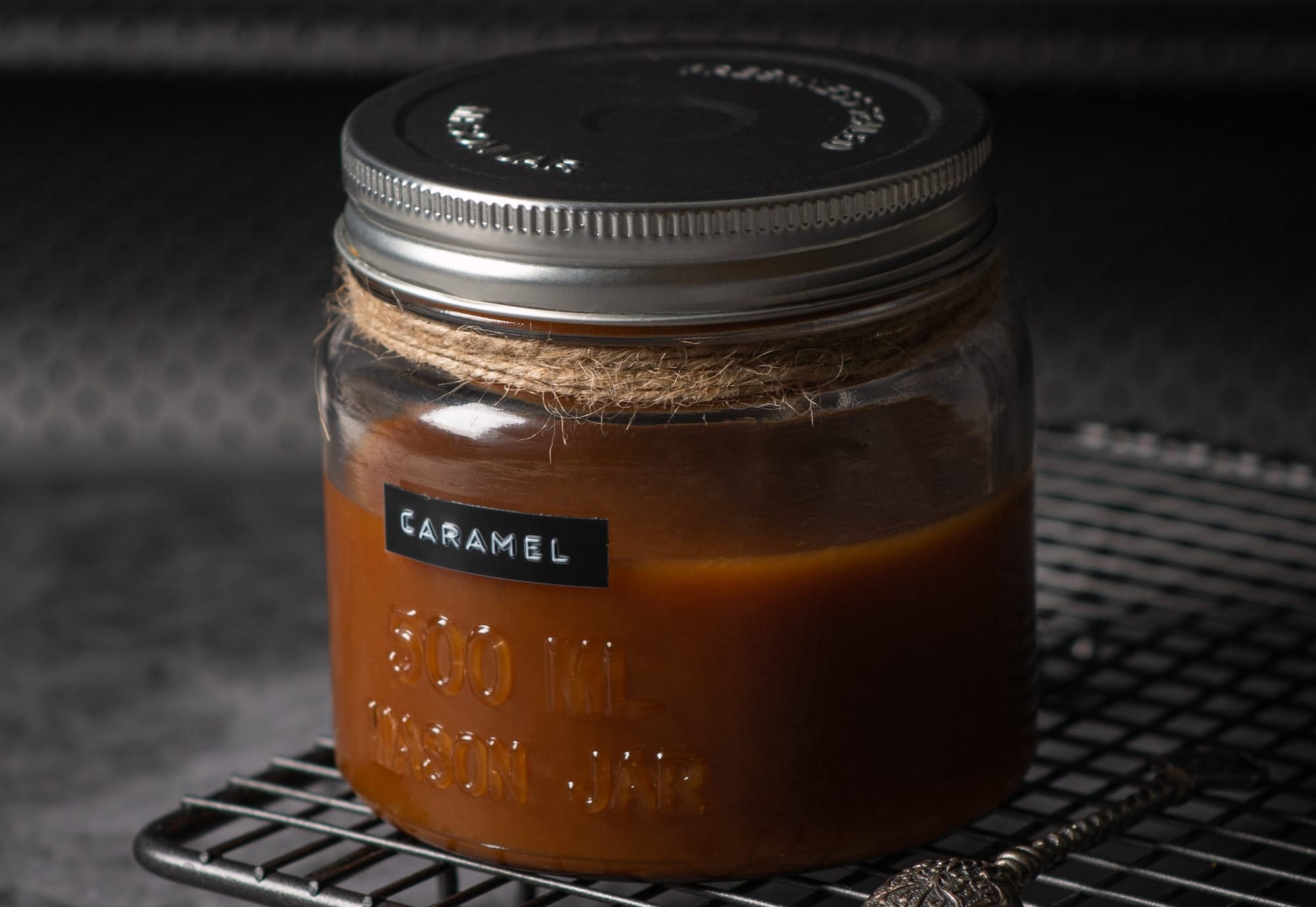 black and brown glass jar on black metal table