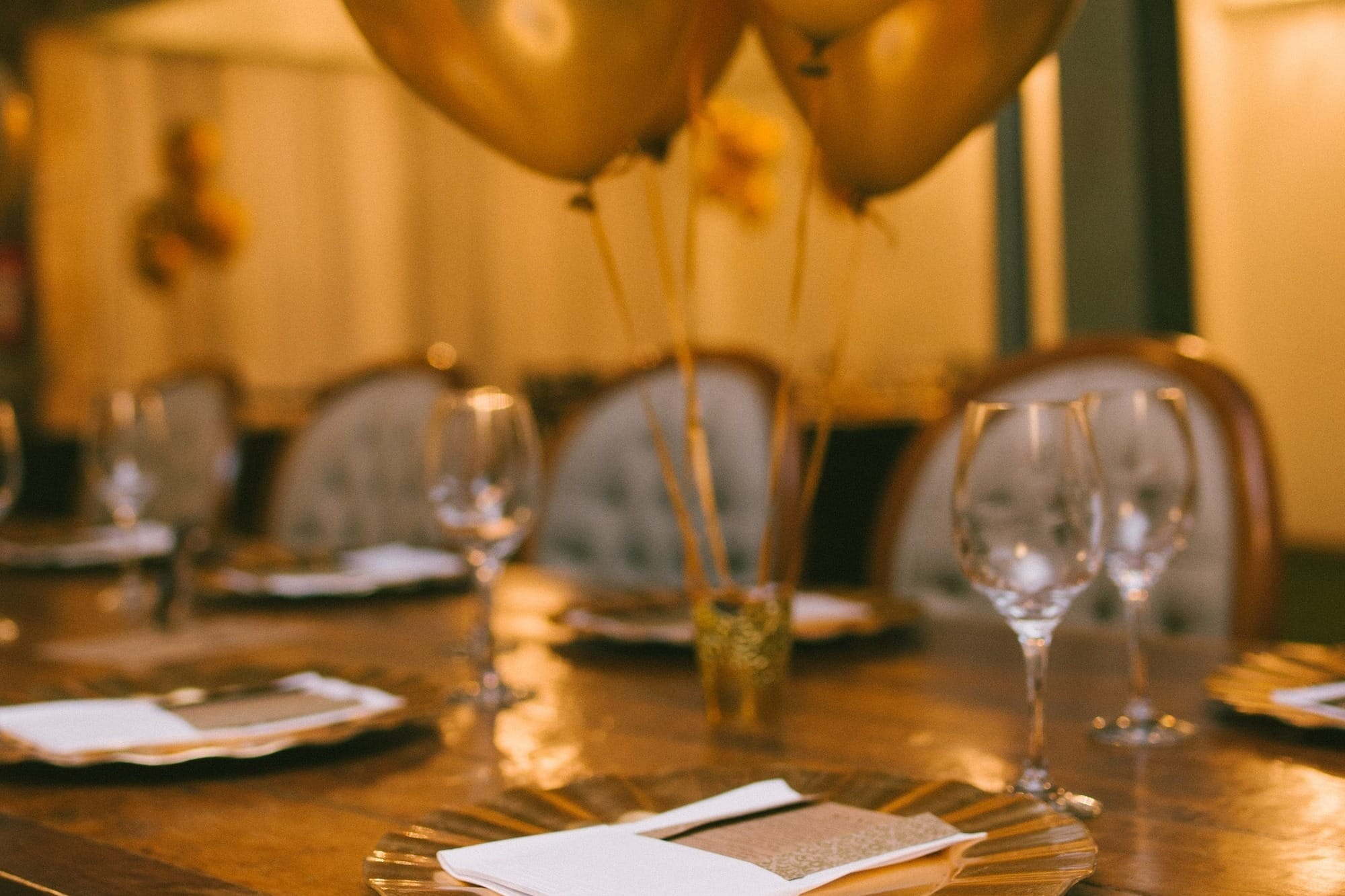 gold balloons on brown wooden table