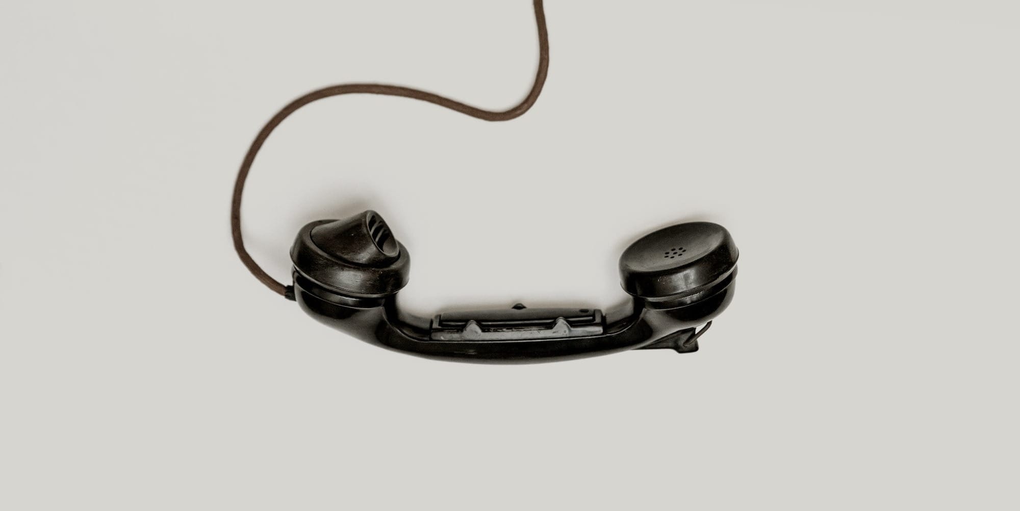 black corded telephone used for calling a customer service number