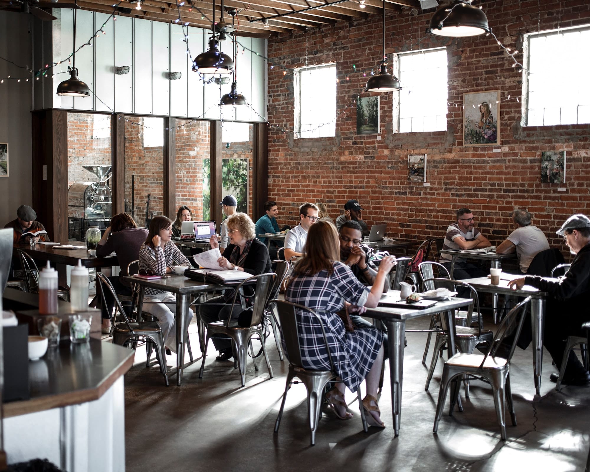 People in a restaurant making connections and enjoying their food.