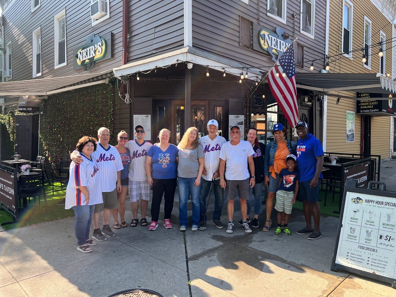 Loycent Gordon in front of Neir's Tavern with friends.