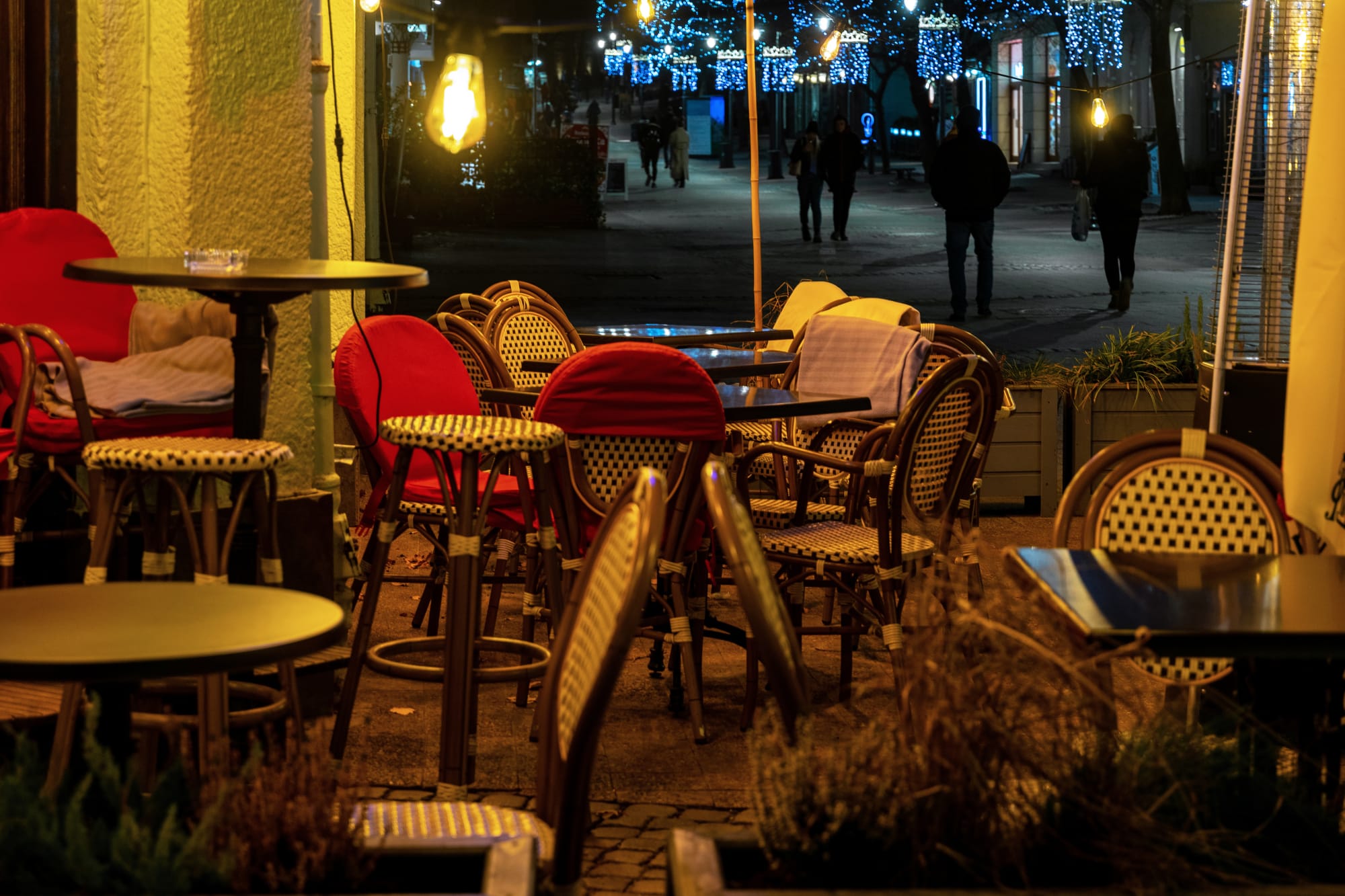 Empty bistro tables with chairs available for hungry guests looking for a bistro setting.