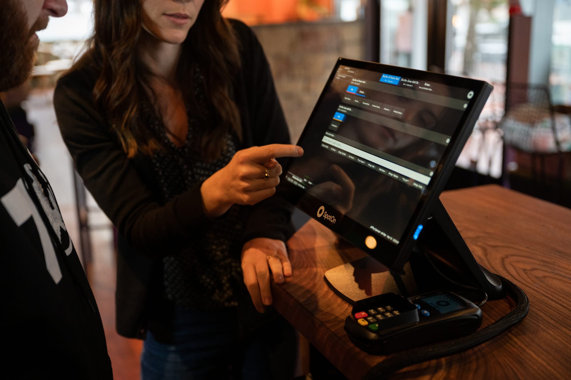 SpotOn point-of-sale system being used by restaurant staff and bar staff to easily serve guests