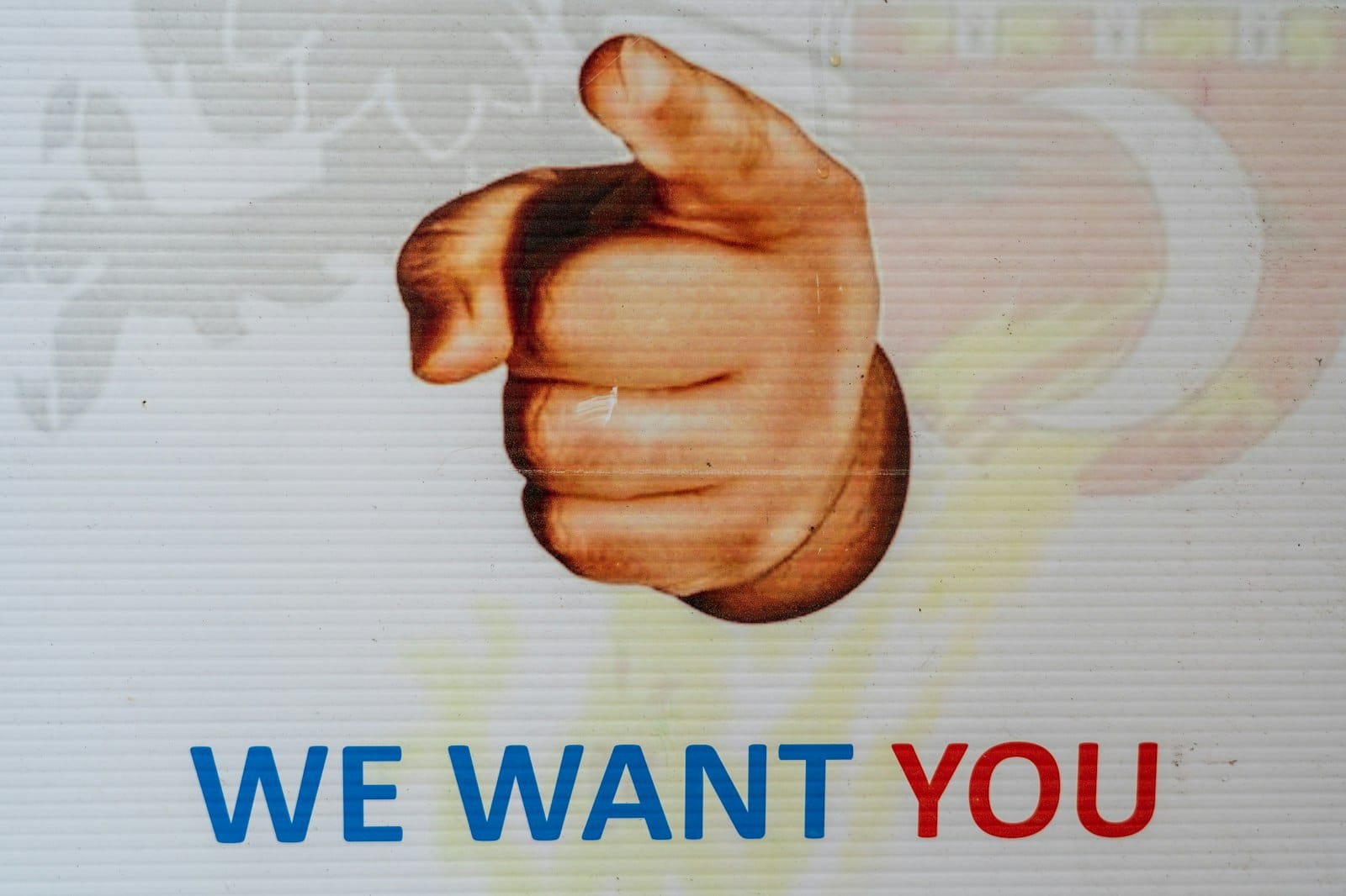 Advertisement with a pointing finger that says, "WE WANT YOU".