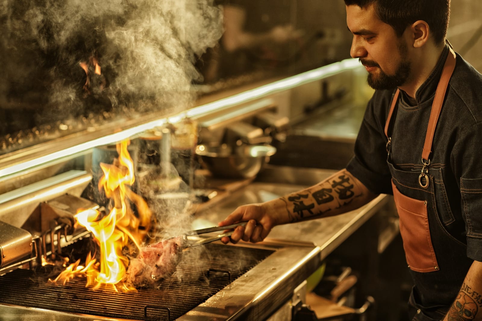 Restaurant chef grilling chicken for a prix fixe lunch menu dinner options at a restaurant