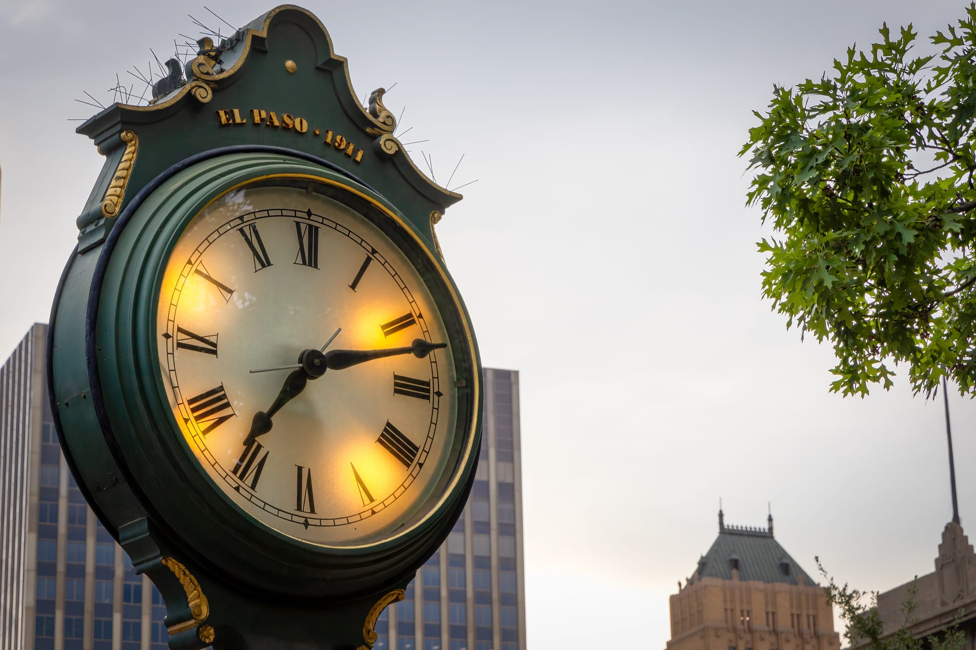 Clock from El Paso Texas with office restaurant buildings in background