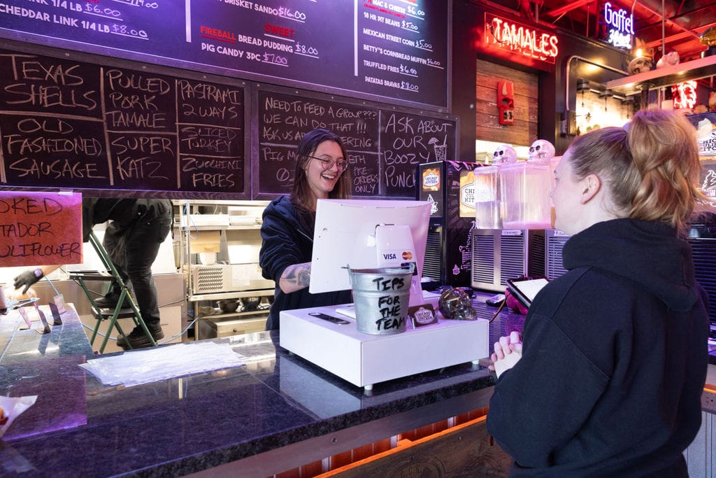 Guest places an order at Chicago Culinary Kitchen.