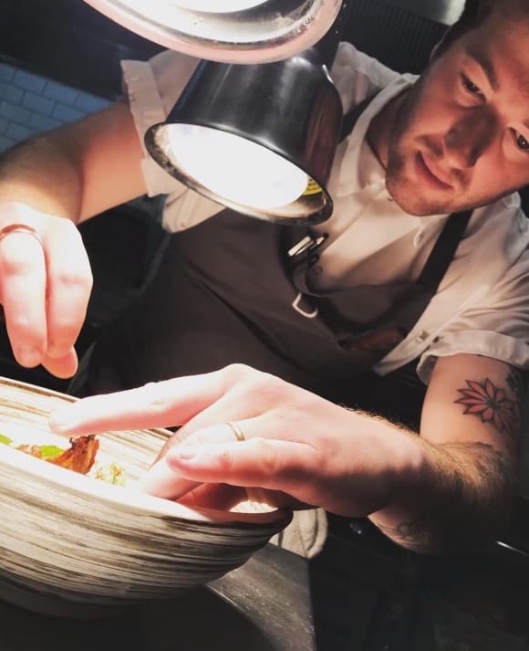 Davey Rabinowitz prepares food in a bowl.