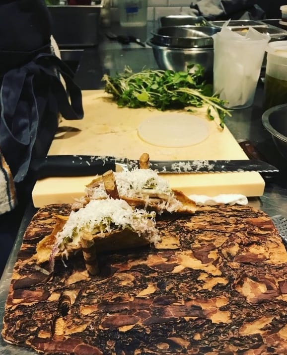 Chicken skin tacos being prepared in the back-of-house.