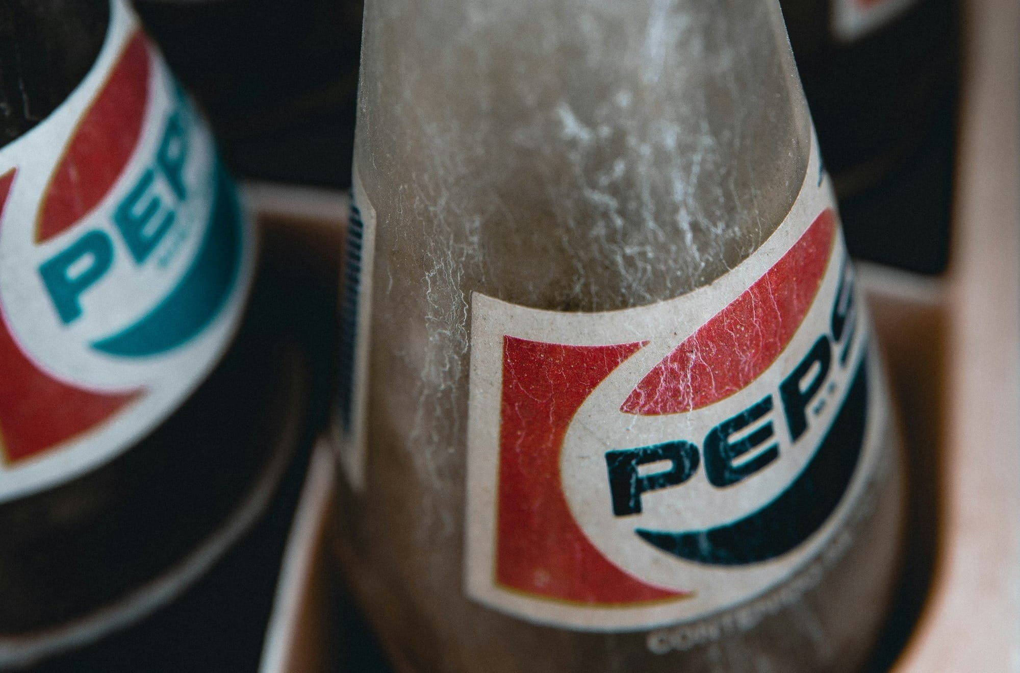 coca cola bottle on brown wooden table