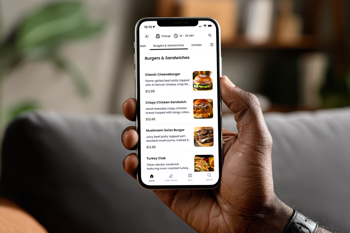 iPhone in hand with online ordering app