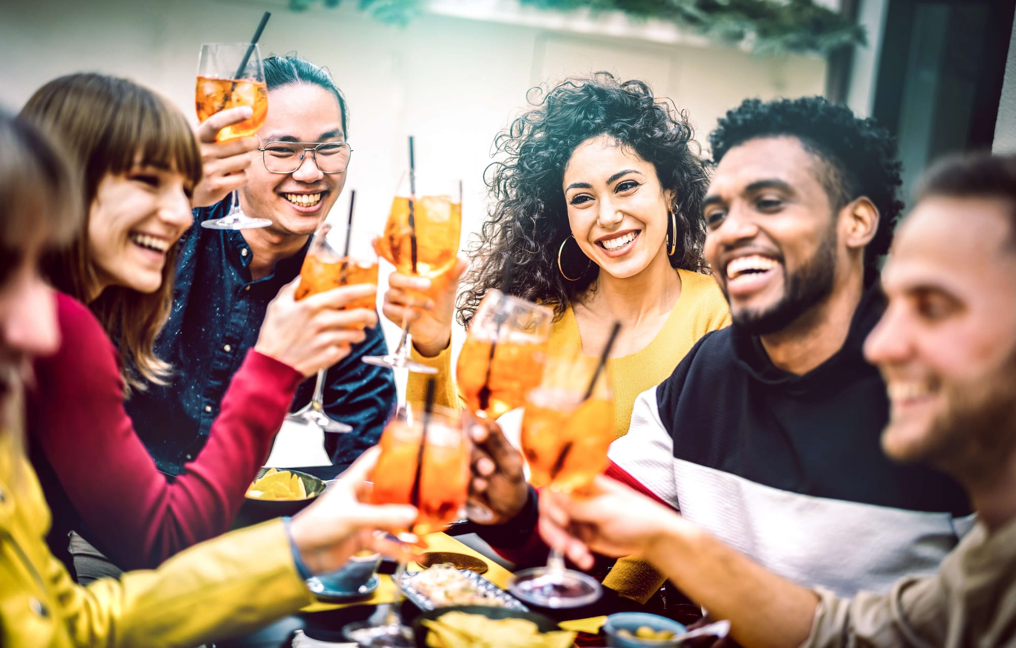 A group of young adults enjoy glasses of iced tea during Dry January