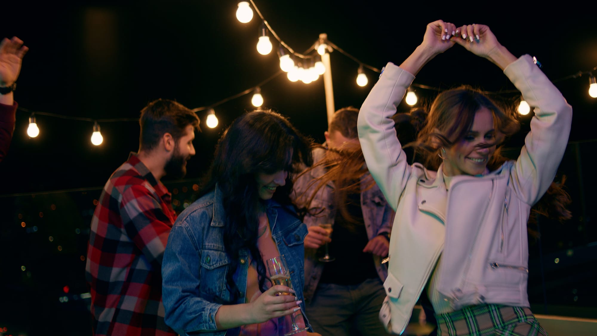 restaurant patio event with music and guests enjoying drinks at night