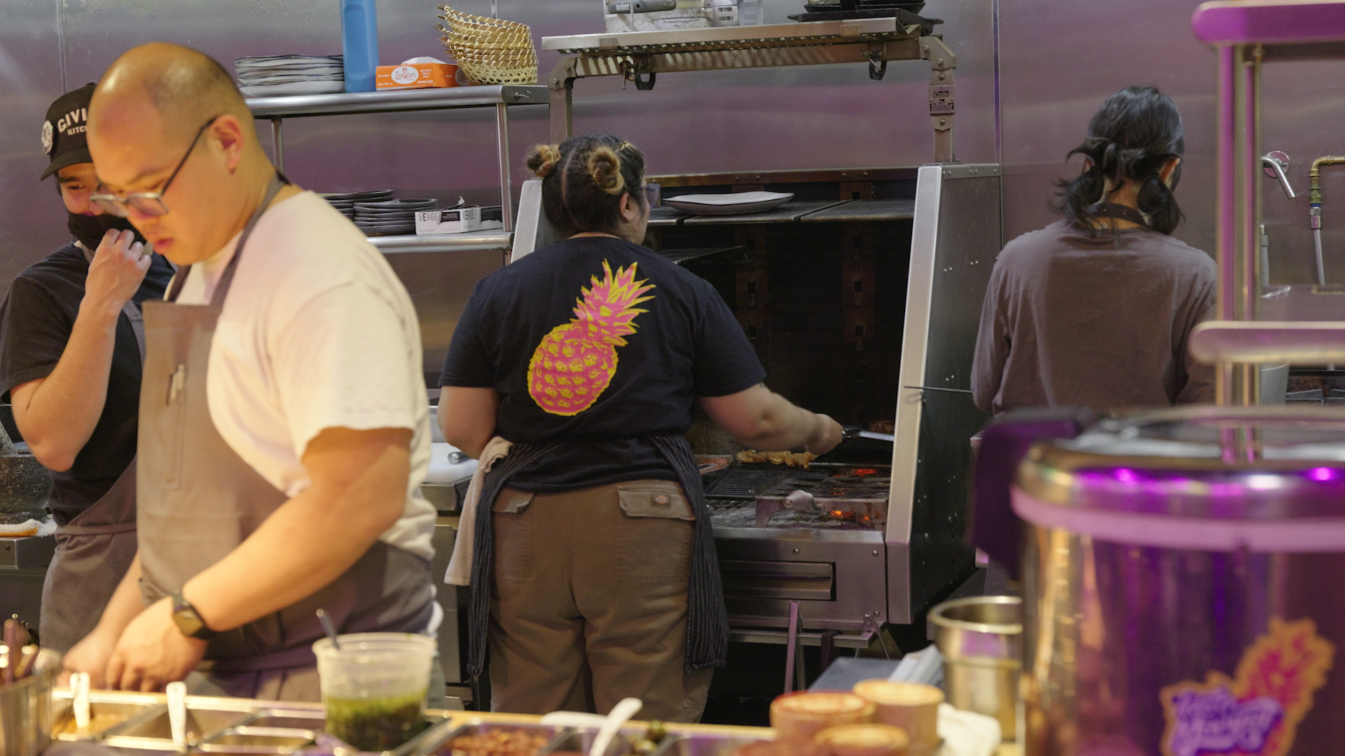 The kitchen crew cooks meals at Talat Market