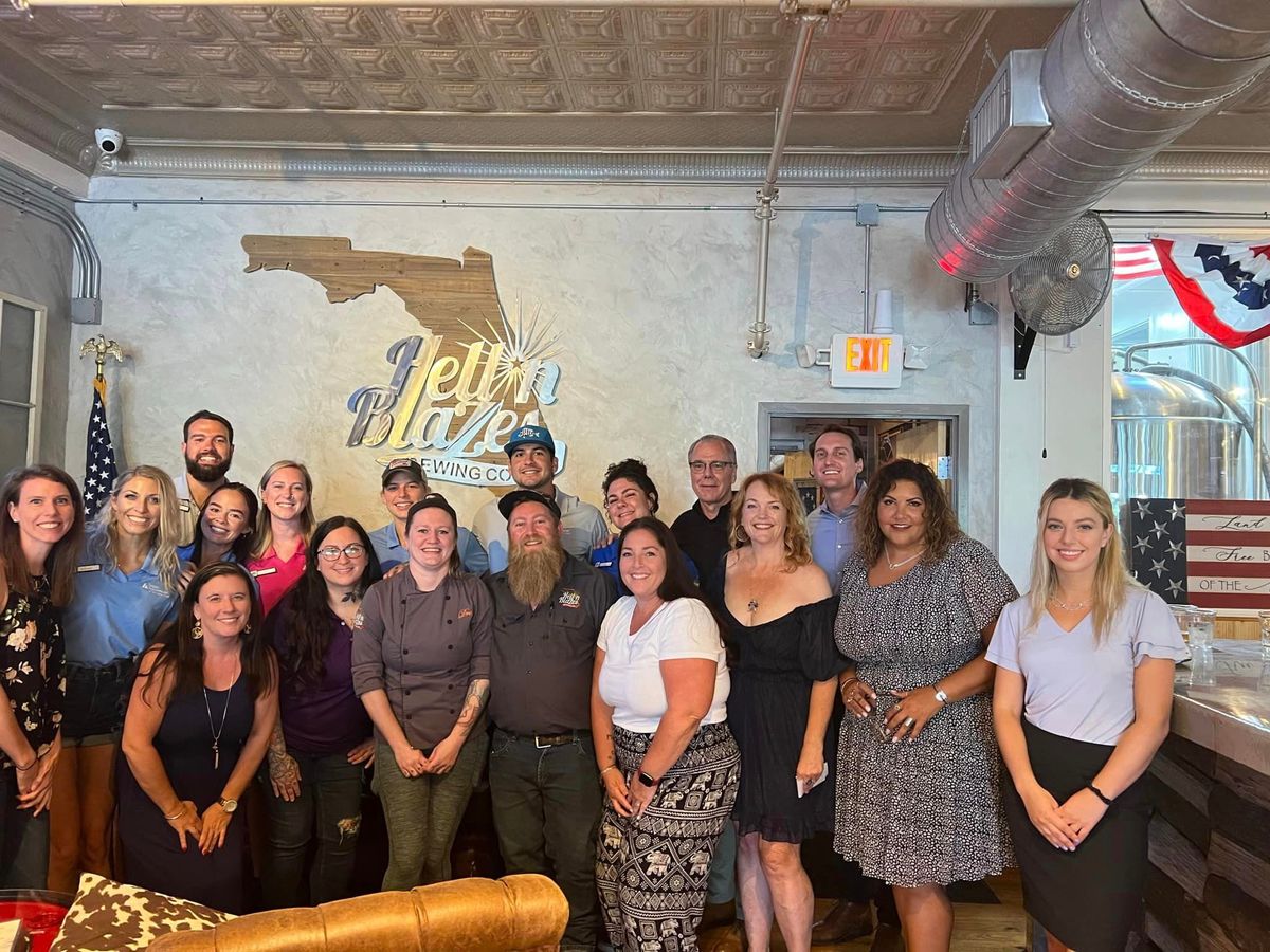 Employees pose for a photo at Hell n' Blazes Brewing Company