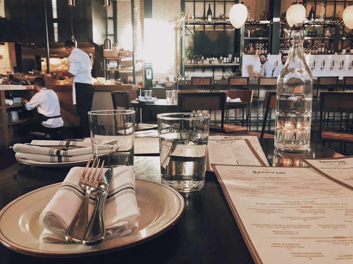 Busy restaurant staff prepare a restaurant for guests