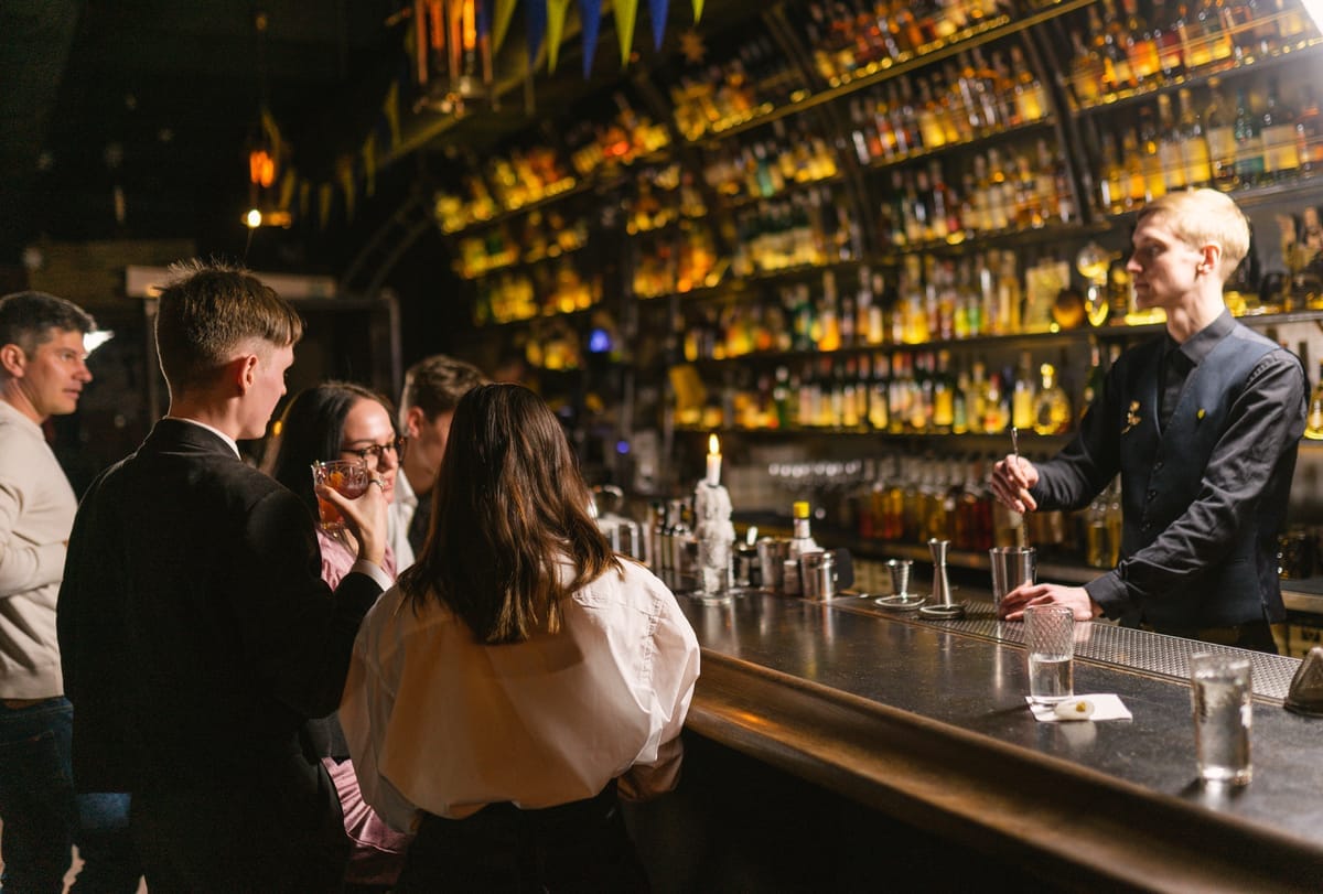 Well drinks being served to guests at a bar.