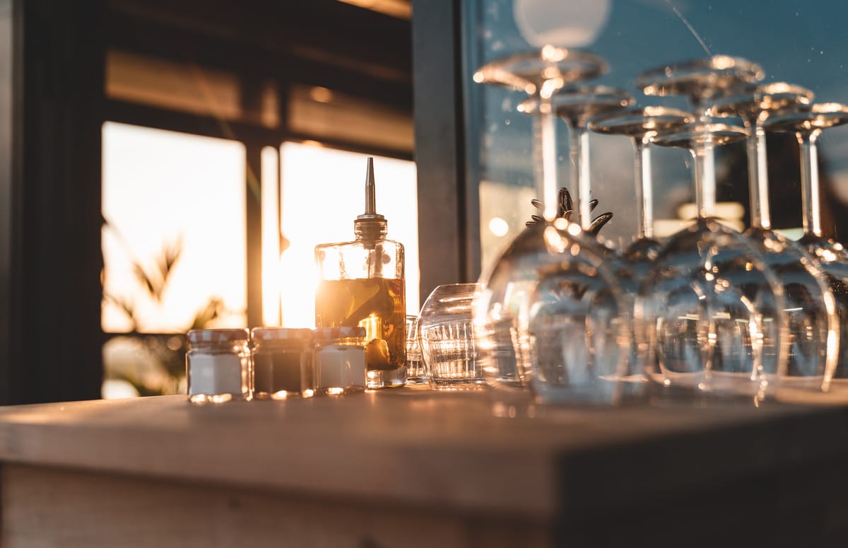 Image of glasses at a bar bistro cafe restaurant with food and seasonings