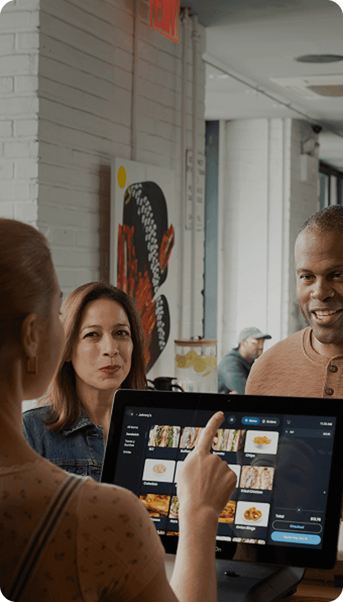 Guests ordering food at SpotOn POS in a fast casual restaurant