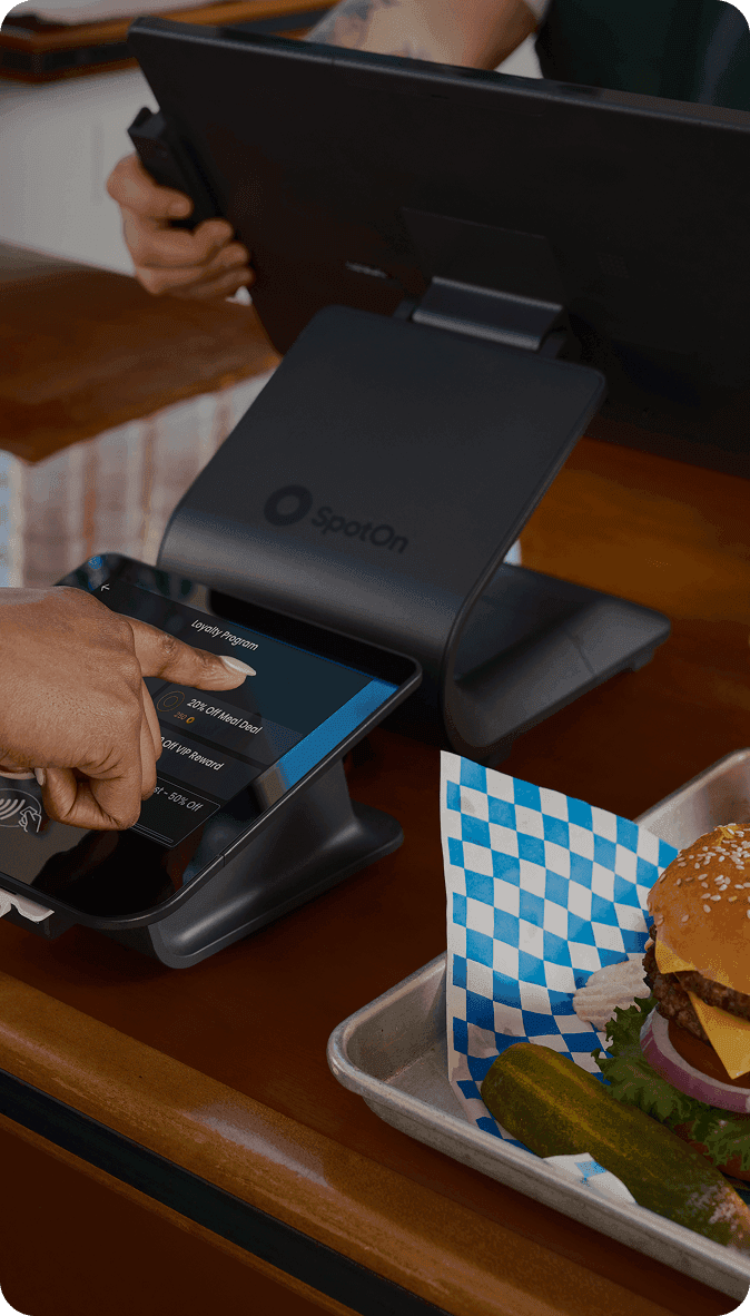 Employee taking an order at a quick service restaurant counter