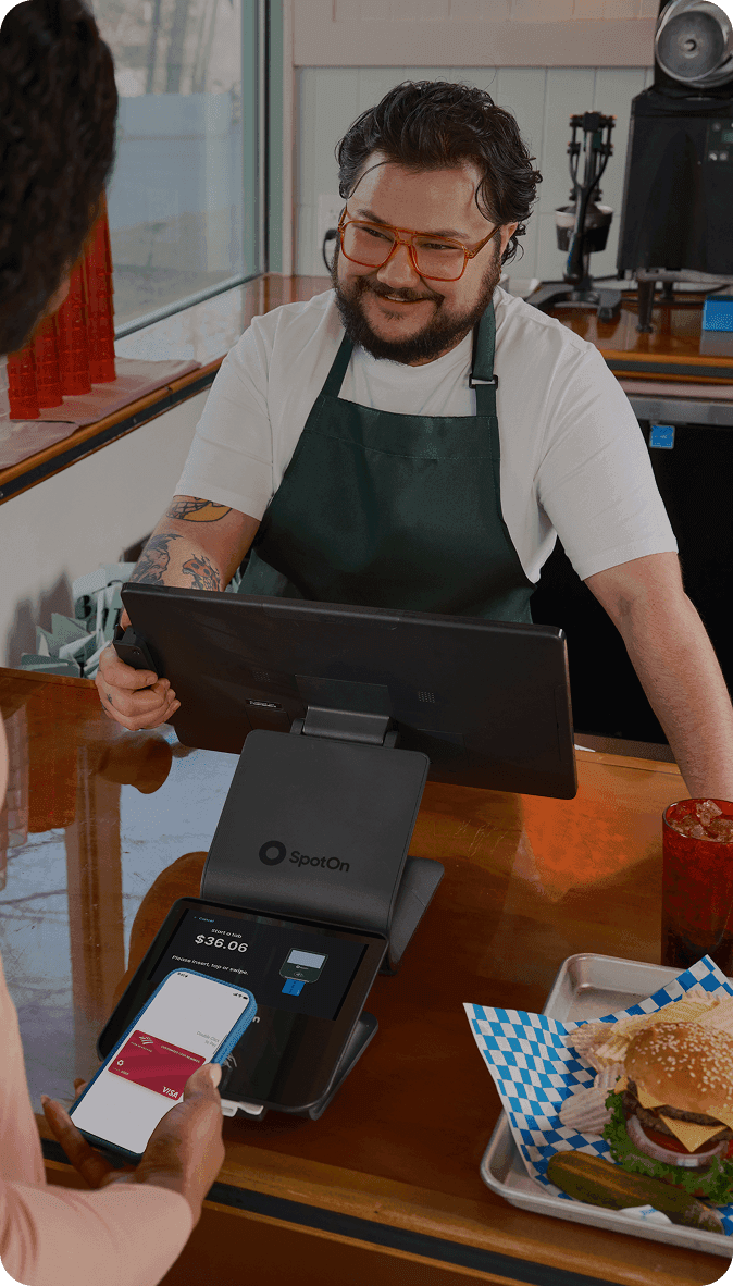 SpotOn POS system processing quick service order with burgers and fries